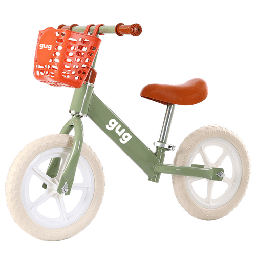 Bicicleta de equilibrio verde com cesta
